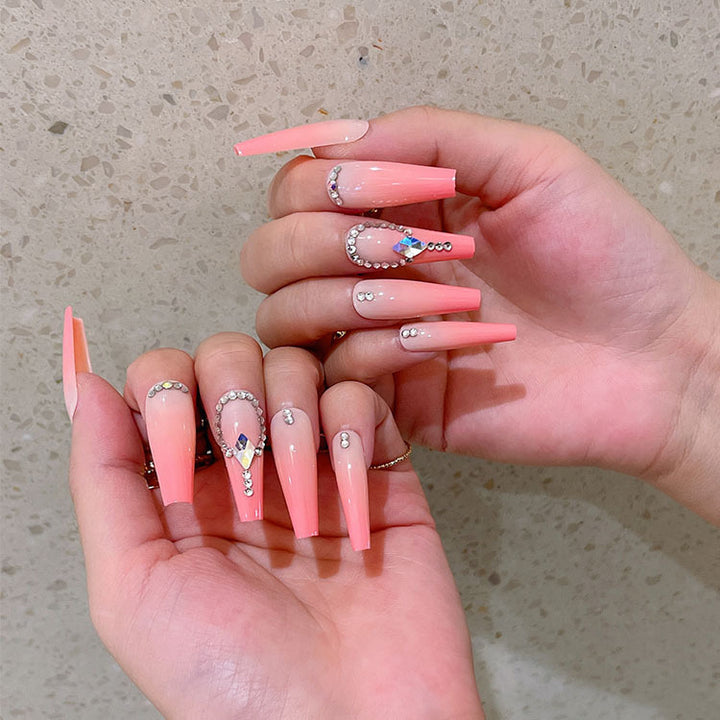 Artificial nails with glitter and stone embellishments Bowlift