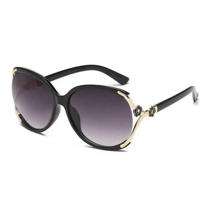 Ladies elegant oversized sunglasses with golden accents Bowlift