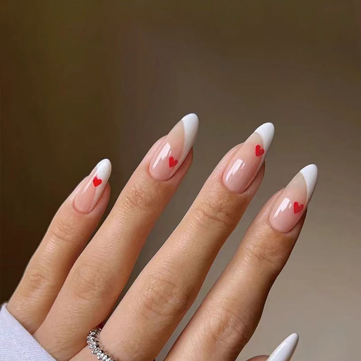Elegant French Tip Press-On Nails with Heart Accents Bowlift