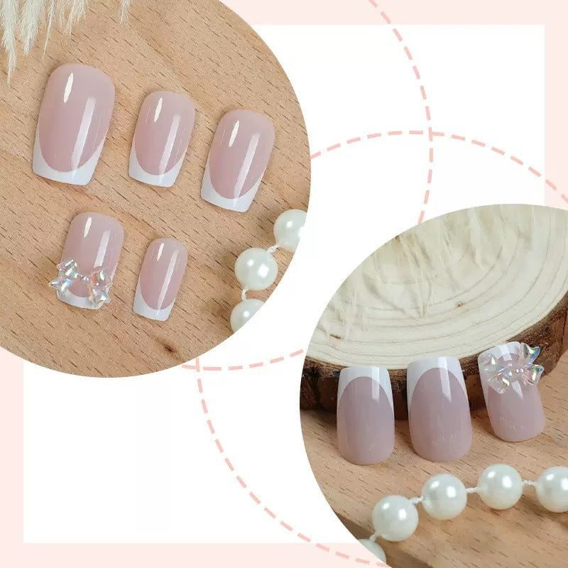 Artificial nail set with glamorous French tips and sparkling accents Bowlift
