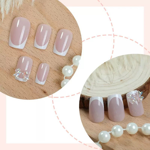 Artificial nail set with glamorous French tips and sparkling accents Bowlift