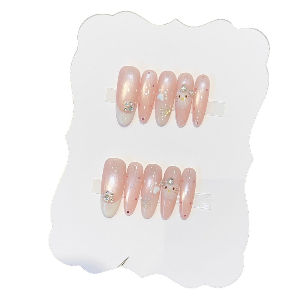 Artificial nail tips with playful penguin and paw print design Bowlift