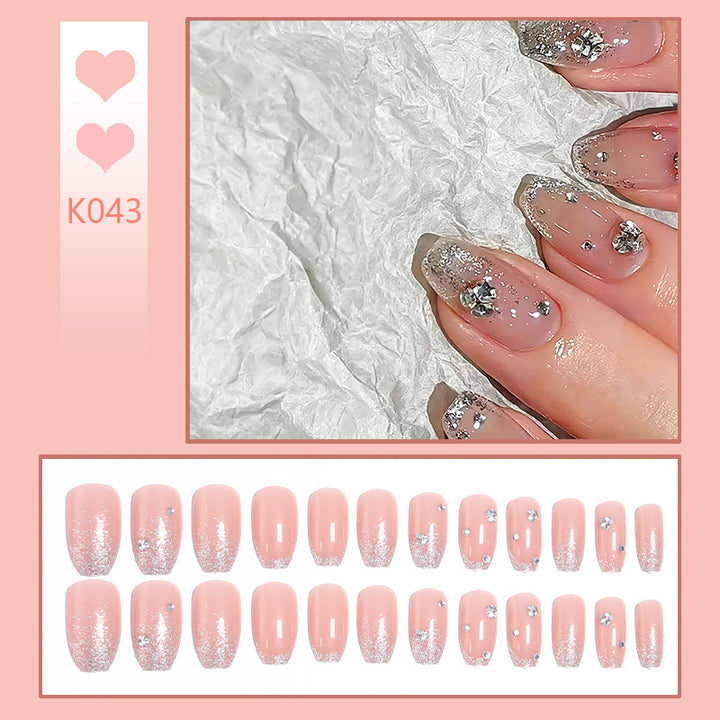 Acrylic nail set with extravagant glitter and crystal embellishments Bowlift