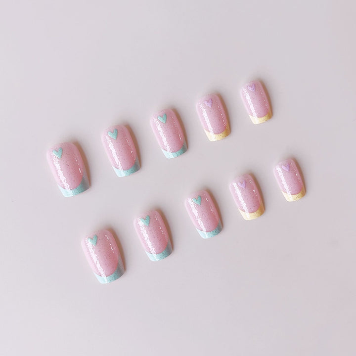 Artificial nail set with playful color gradients and heart motifs Bowlift