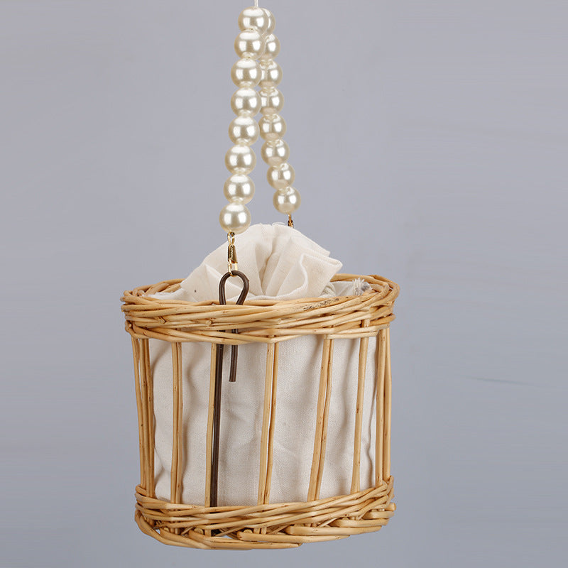 Women's elegant basket bag with pearl chain Bowlift