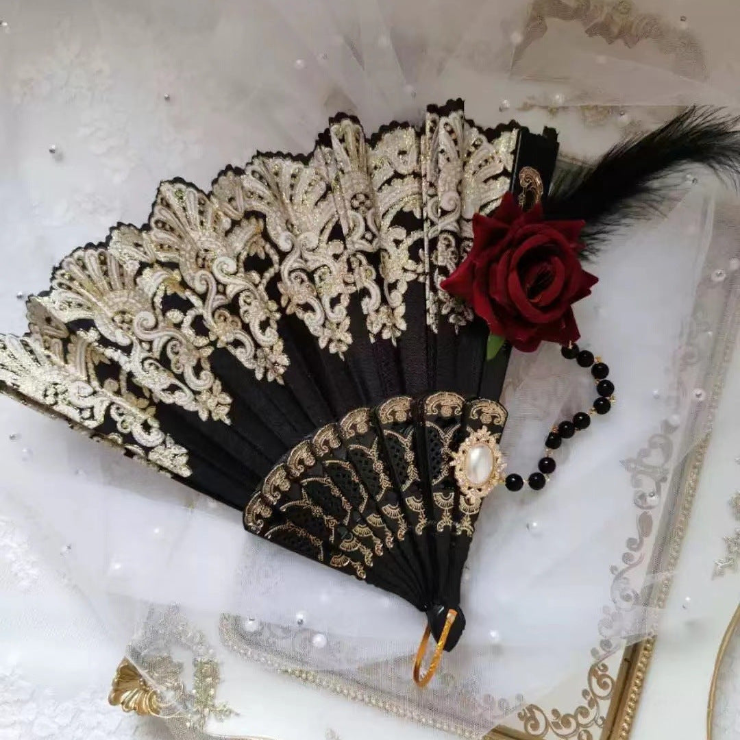 Women's fan with exquisite filigree ornamentation Bowlift