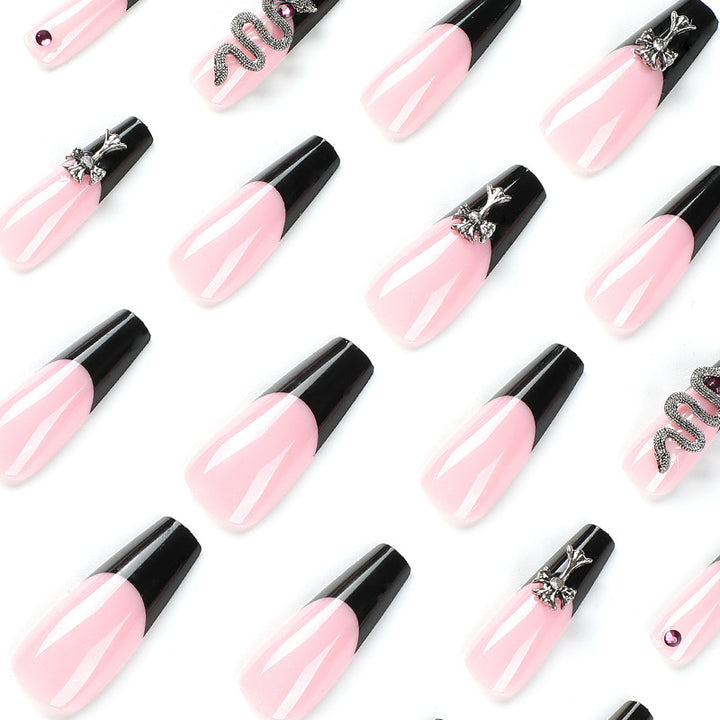 Artful stiletto nails with glitter accents and creative design Bowlift