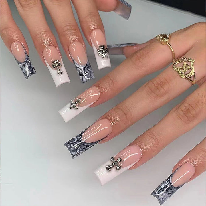 Exquisite artificial nails with textured designs and jewelry accents Bowlift