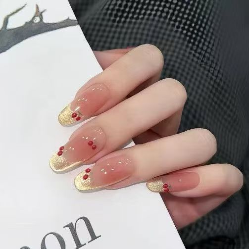 Artificial nails with sparkling rhinestones and 3D applications Bowlift
