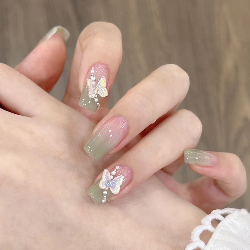 Artificial artificial nails with elegant ombre design and jewelry accents Bowlift