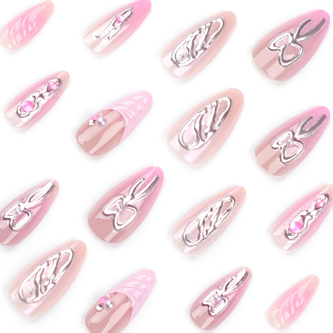 Artful stiletto nails with glitter and pearl decorations Bowlift