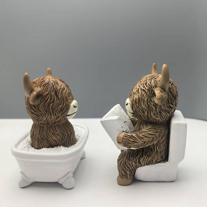 Funny decorative figure of a Highland cow in a bathtub Bowlift