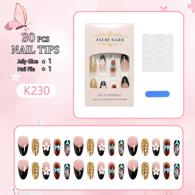 Artificial nail set with filigree floral decorations and glamorous accents Bowlift