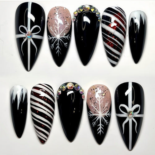 Artificial nail set with festive design and glitter accents Bowlift