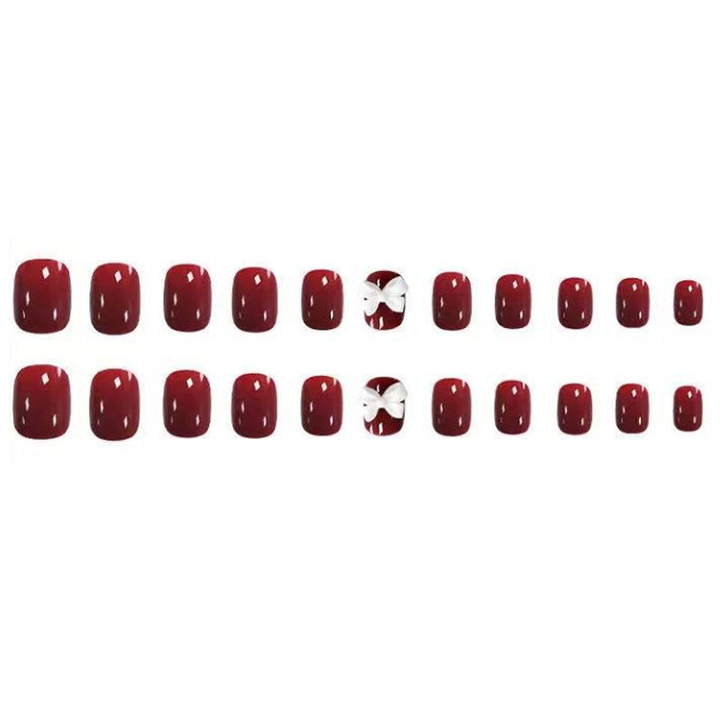 Artificial nails with elegant bow motifs Bowlift