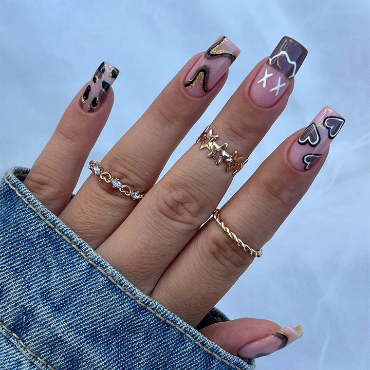 Artful nail extensions in elegant design with gold accents Bowlift