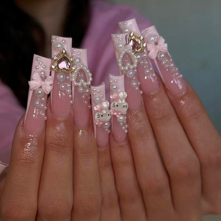Glamorous artificial nails with 3D decorations and pearl accents Bowlift
