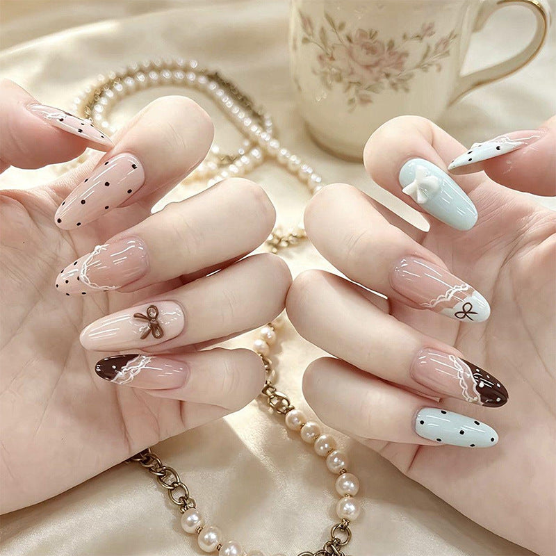 Artificial nail set with elegant accents and fine designs Bowlift