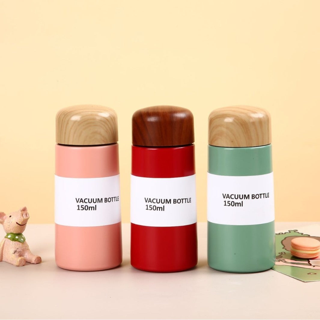 Women vacuum-insulated water bottle with innovative wooden lid Bowlift