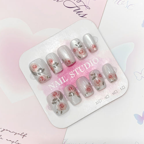 Artful nail extensions with rose designs Bowlift