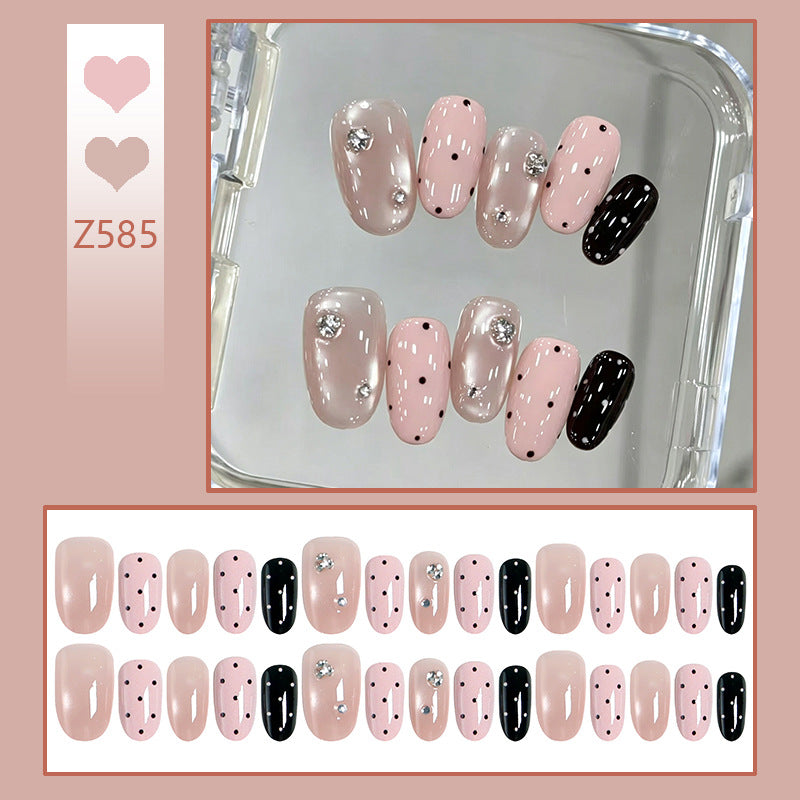 Acrylic nail set with glamorous rhinestone accents and modern dots Bowlift