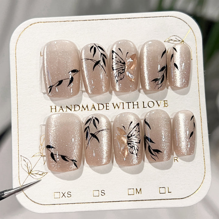 Artificial nail extensions with floral butterfly design Bowlift