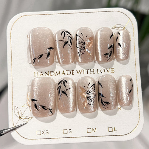 Artificial nail extensions with floral butterfly design Bowlift