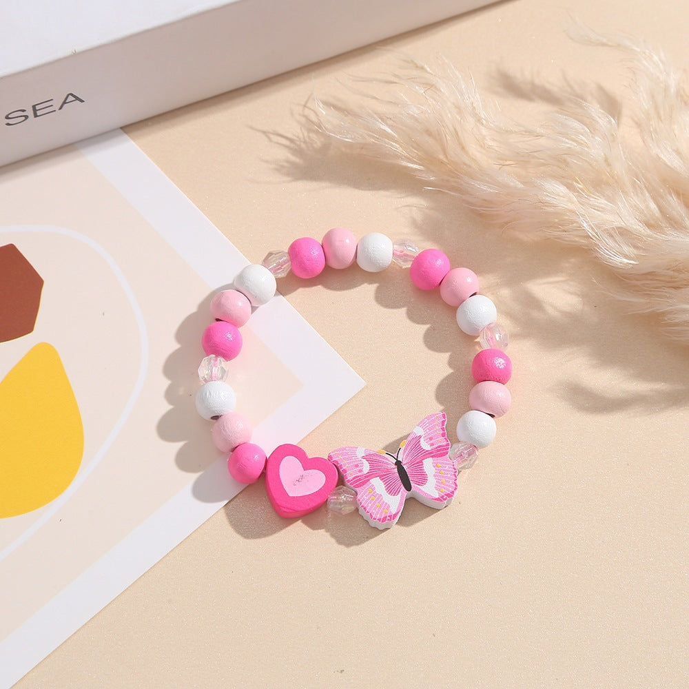 Playful bracelet with heart and butterfly charms Bowlift