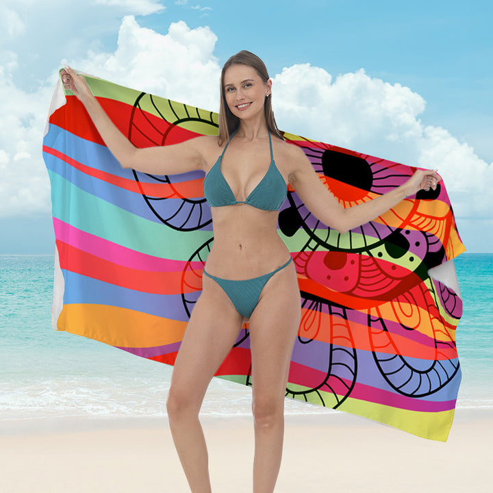 Beach towel with vibrant tropical plant motif Bowlift
