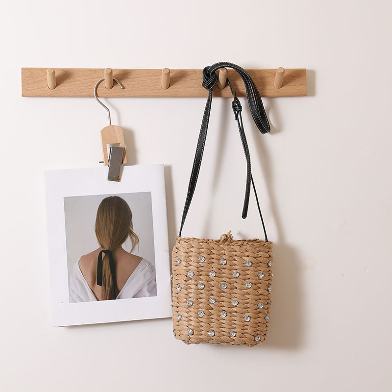 Bag made of woven natural material with sparkling appliqués Bowlift