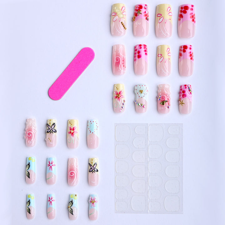 Artistic nails with floral accents and glitter clusters Bowlift