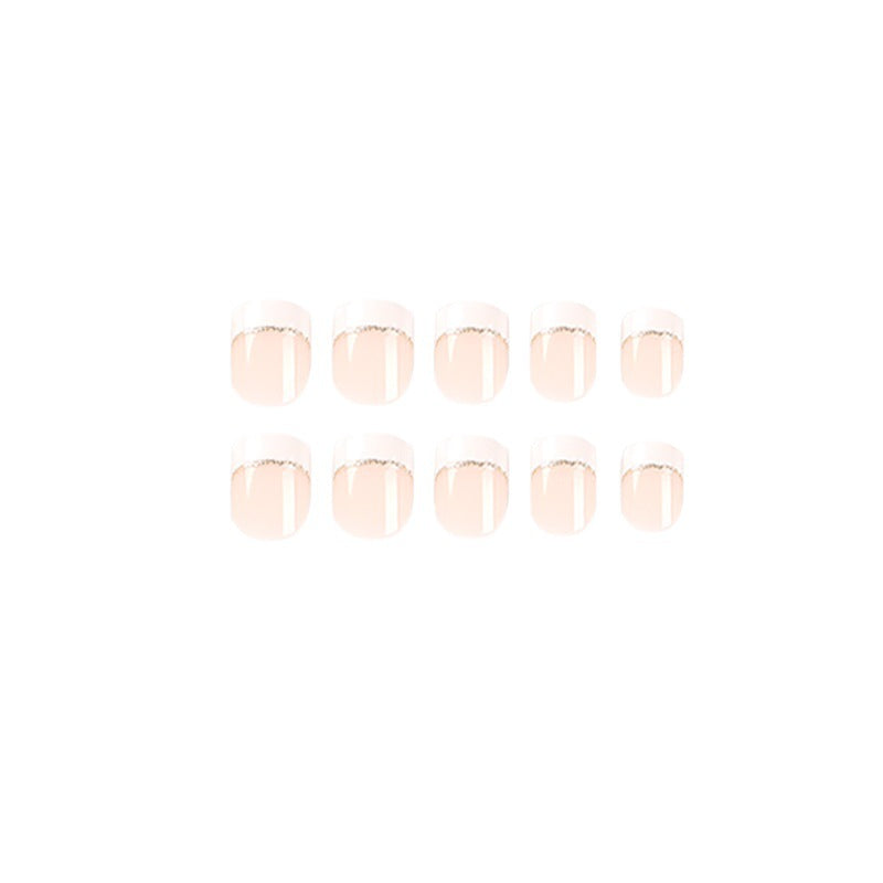 Artful nail extensions with elegant French tip and gold accents Bowlift