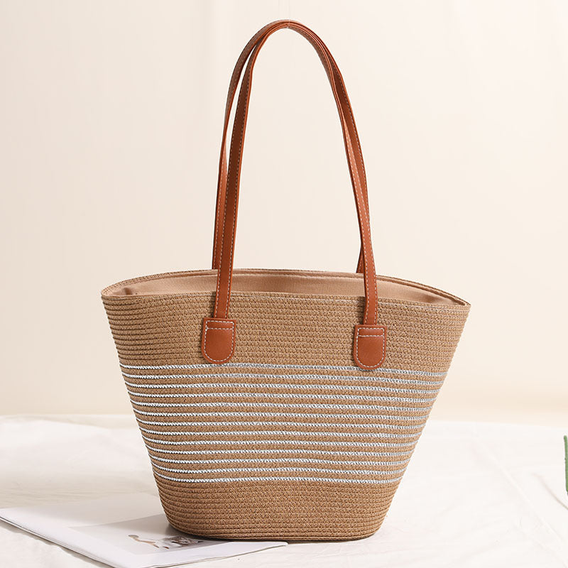 Elegant bast handbag with leather accents Bowlift