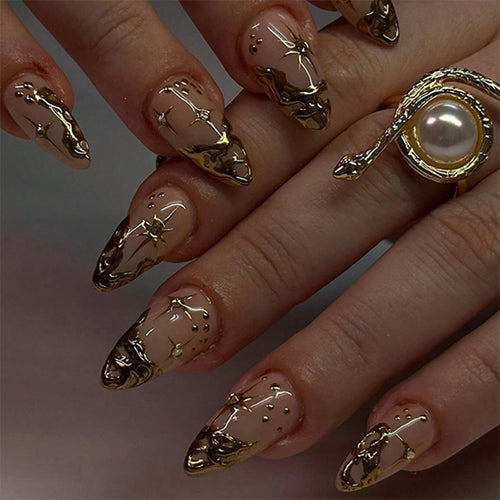 Creative nail set with elegant gold embellishments and sparkling accents Bowlift