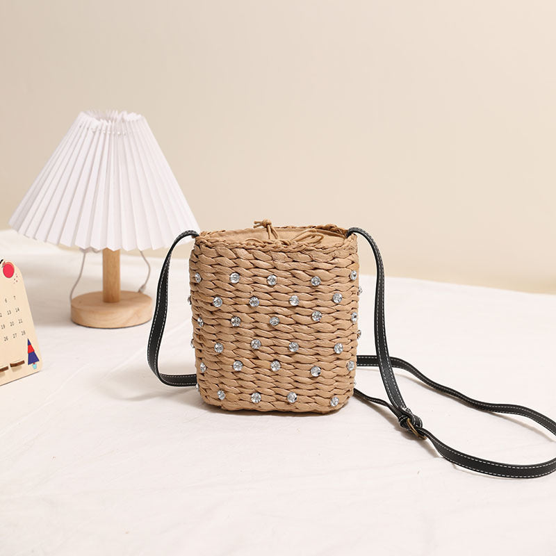 Bag made of woven natural material with sparkling appliqués Bowlift