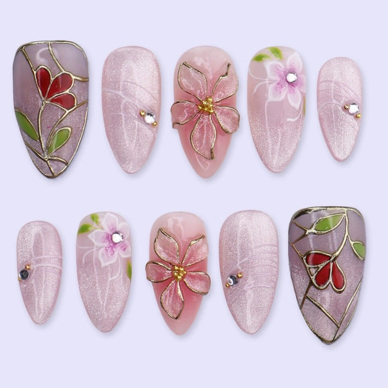 Artificial nail set with luxurious floral designs and glitter accents Bowlift