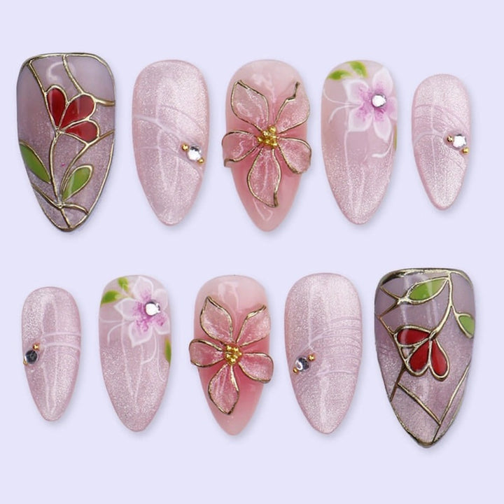 Artificial nail set with luxurious floral designs and glitter accents Bowlift