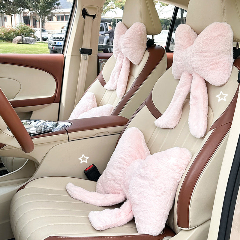 plush bow-shaped decorative throw cushion with long tails and faux-fur texture Bowlift