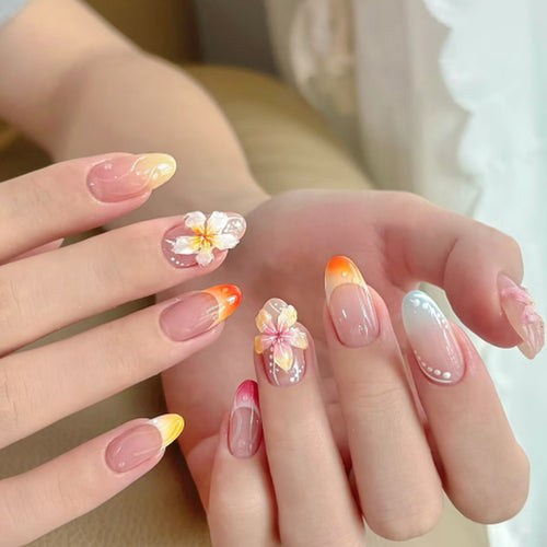 Artistic nail designs with floral accents and soft color gradients Bowlift