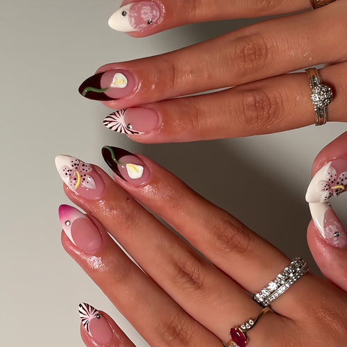 Artificial nails with creative floral designs and glitter accents Bowlift