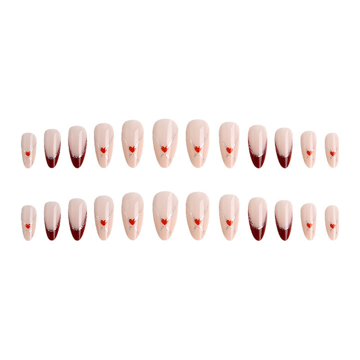 Acrylic nails with heart motifs and glitter details Bowlift
