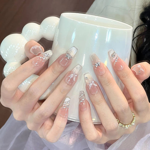 Decorative Long Stiletto Press-On Nails with Heart and Floral Accents Bowlift