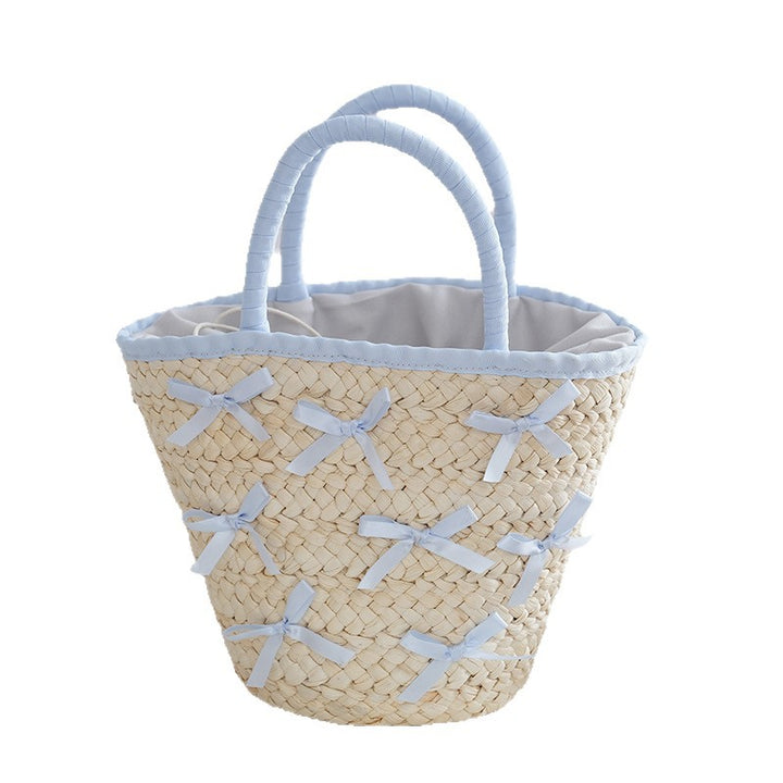 Basket bag with delicate bows and padded edge Bowlift