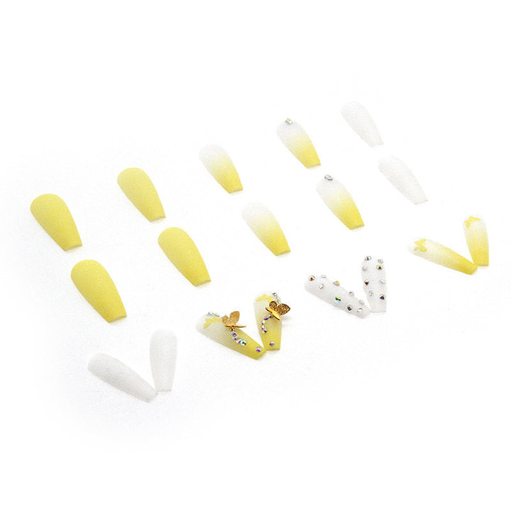 Artificial nail extensions with floral accents and rhinestones Bowlift