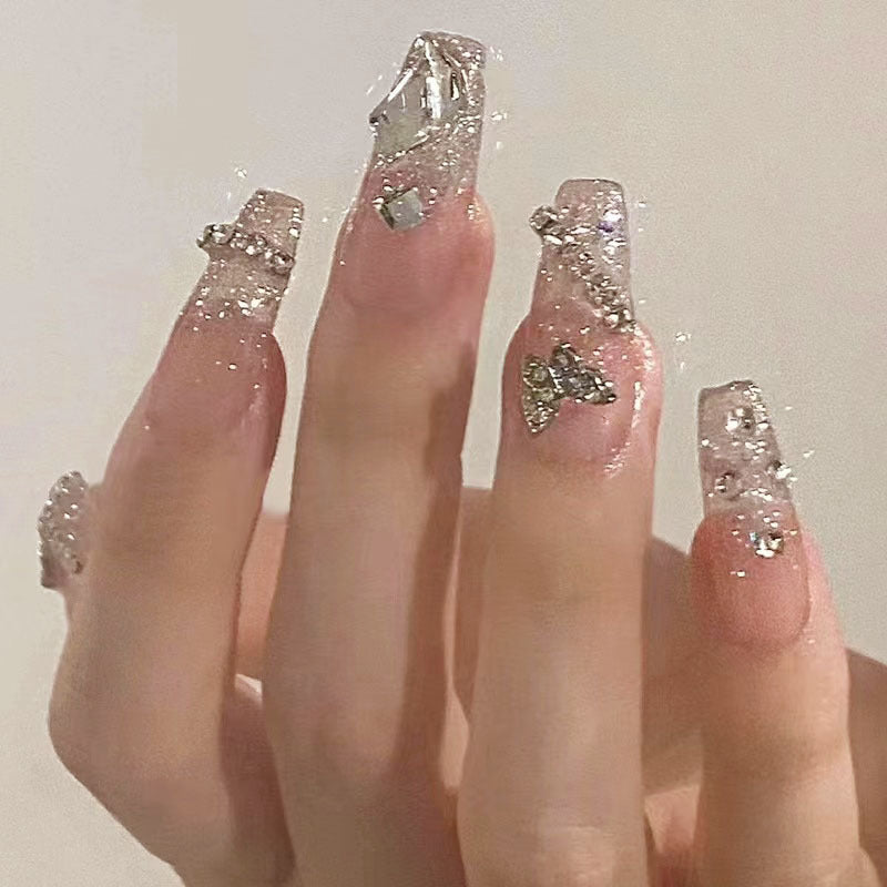 Glamorous artificial nails with sparkling rhinestones and elegant designs Bowlift