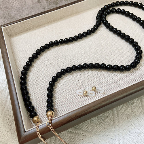 Fashionable jewelry band made of onyx beads Bowlift