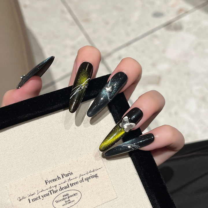 Artistic Stiletto Nail Extensions with Metallic Accents Bowlift
