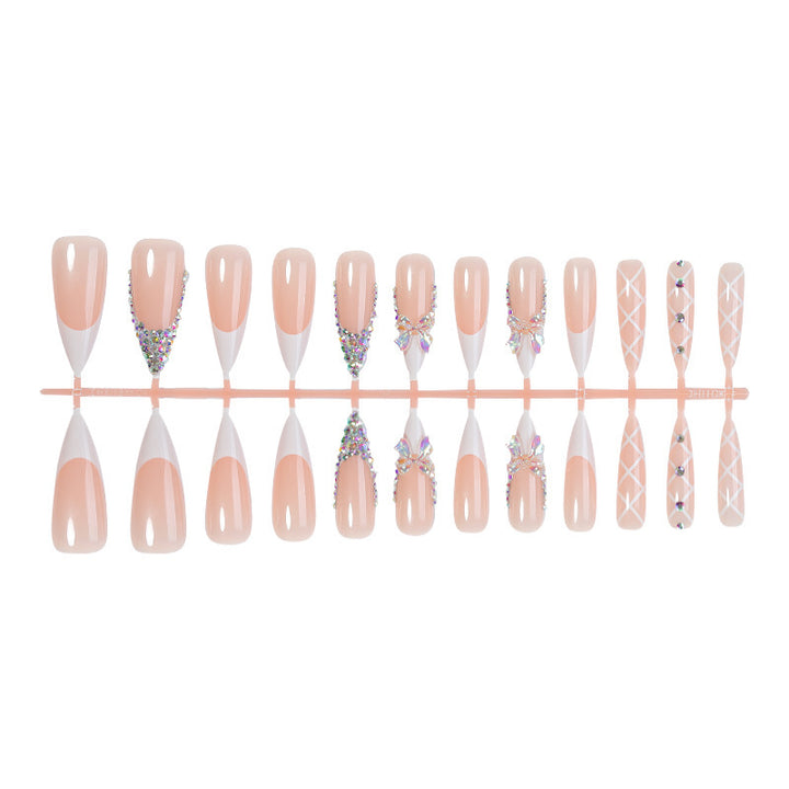 Acrylic nail set with luxurious rhinestone embellishments and bow accents Bowlift