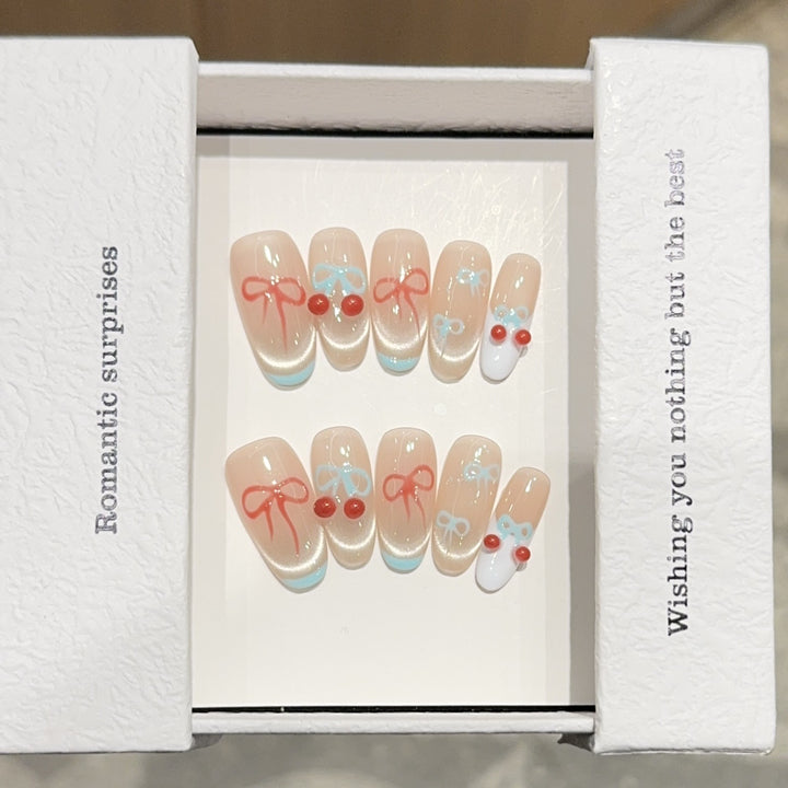 Artificial nail tips with romantic bow and cherry motifs Bowlift