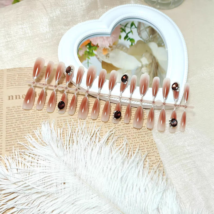 Glamorous artificial nails in elegant ombre style with rhinestone embellishments Bowlift